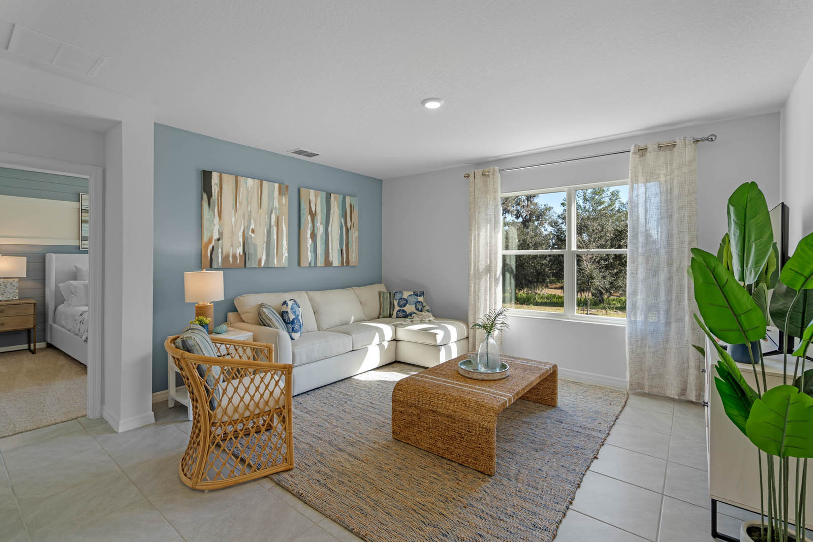 Living room space with couch, coffee table and chair