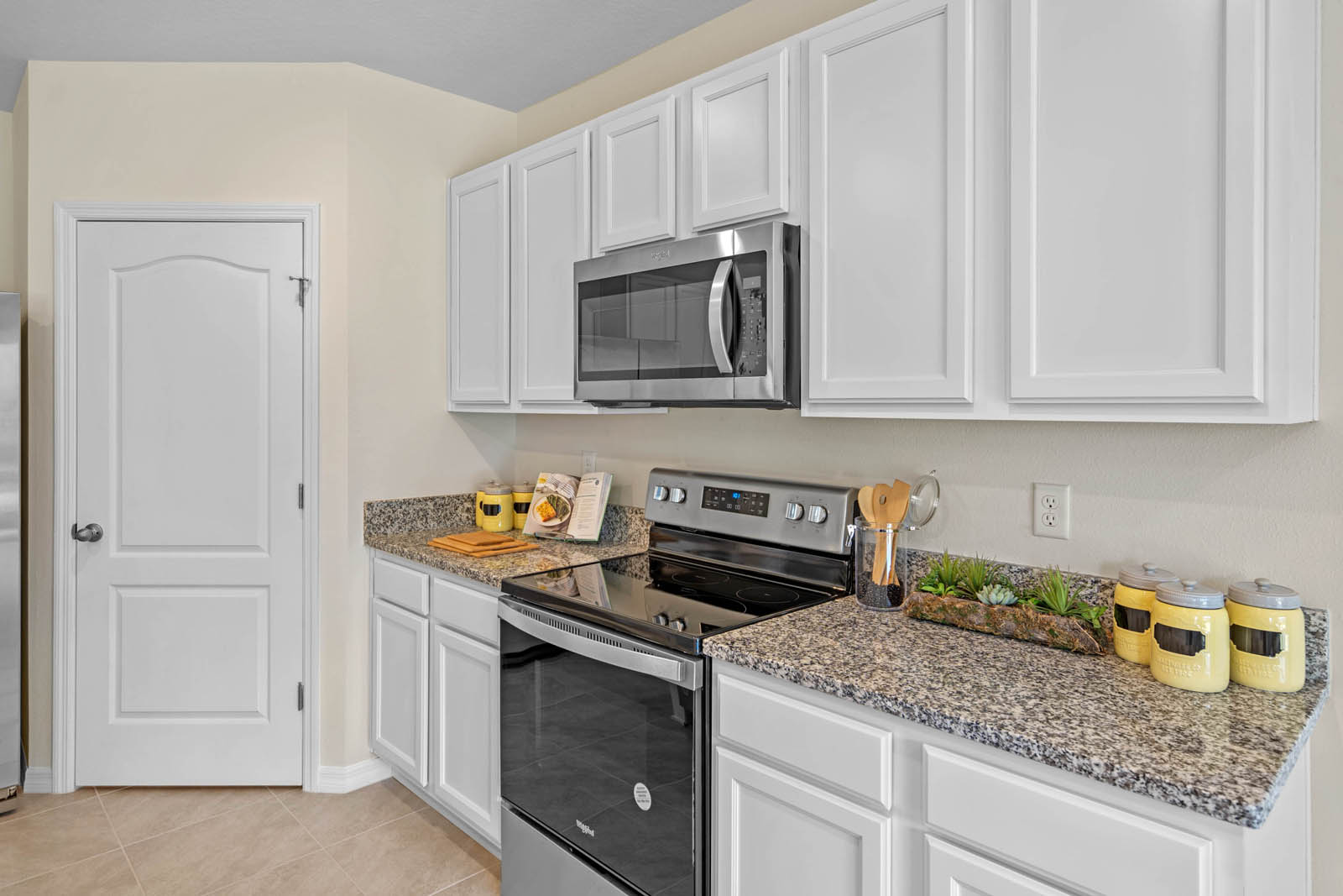 Kitchen appliances and white cabinets