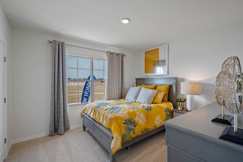 Spare bedroom with bed and window