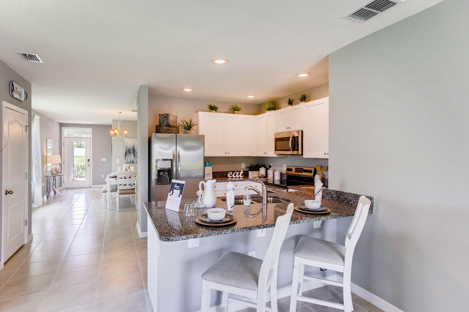 Kitchen Island with 2 barstools at the kitchen