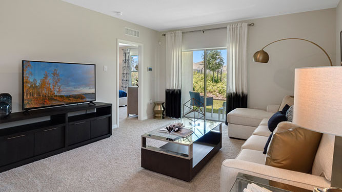 Spacious living room with couch and patio doors