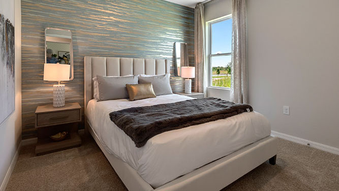 Guest bedroom with queen size bed and window