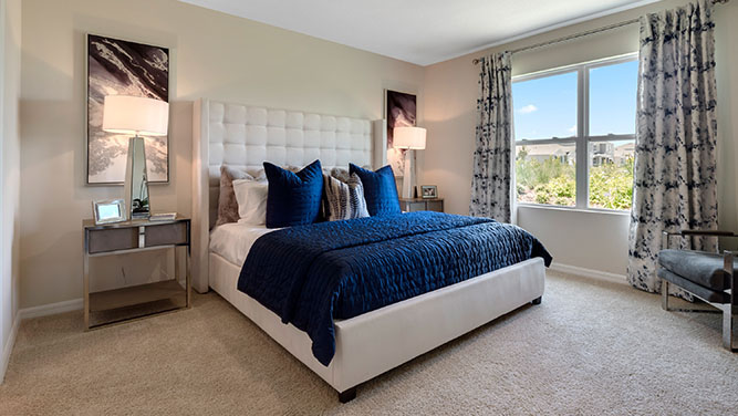 Primary bedroom with king size bed and window