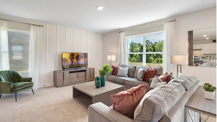 Living room with window facing the backyard