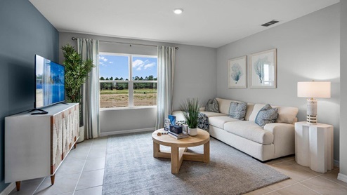 Living room space with a window facing the backyard