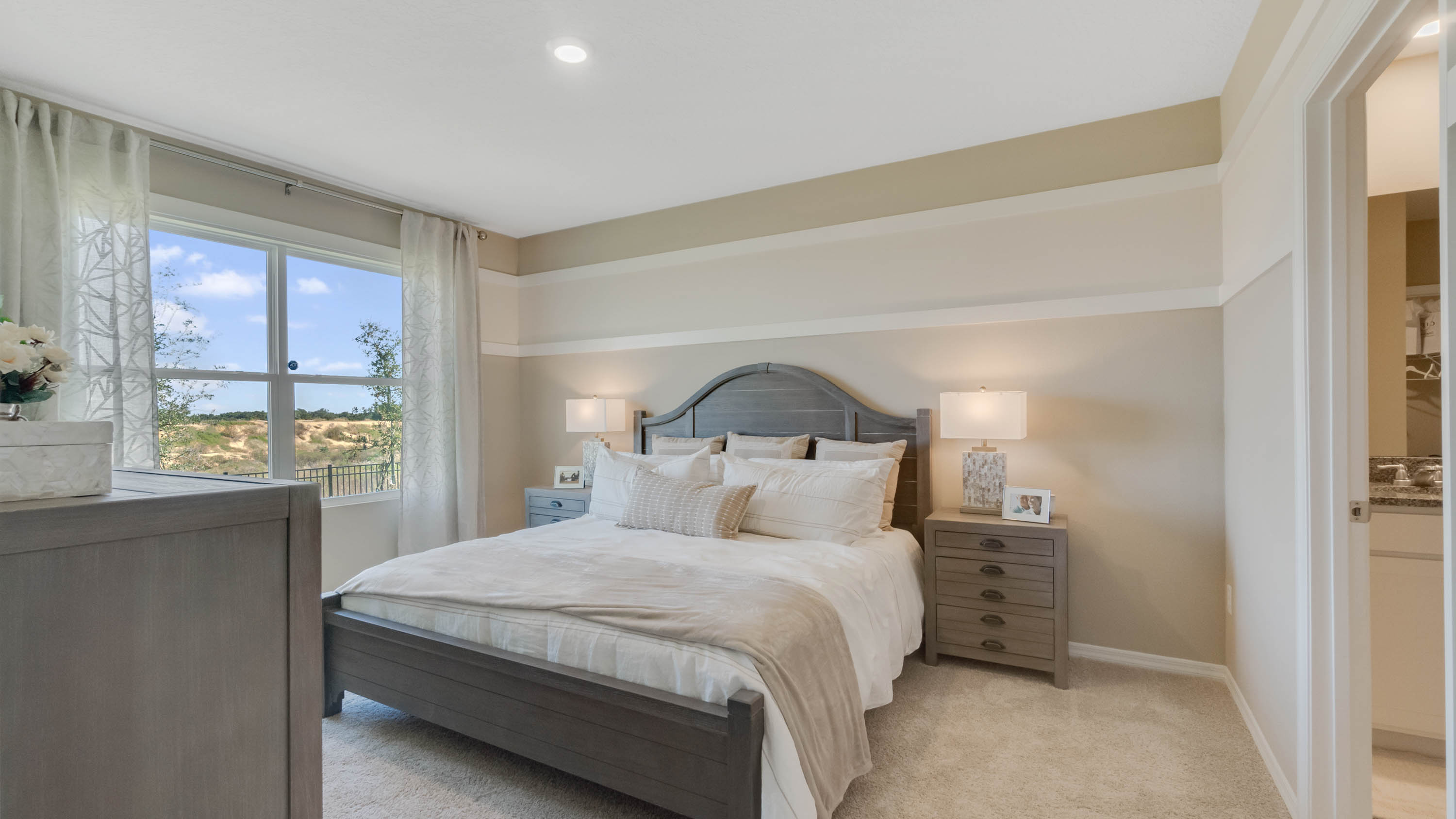 master bedroom with door to the private bathroom