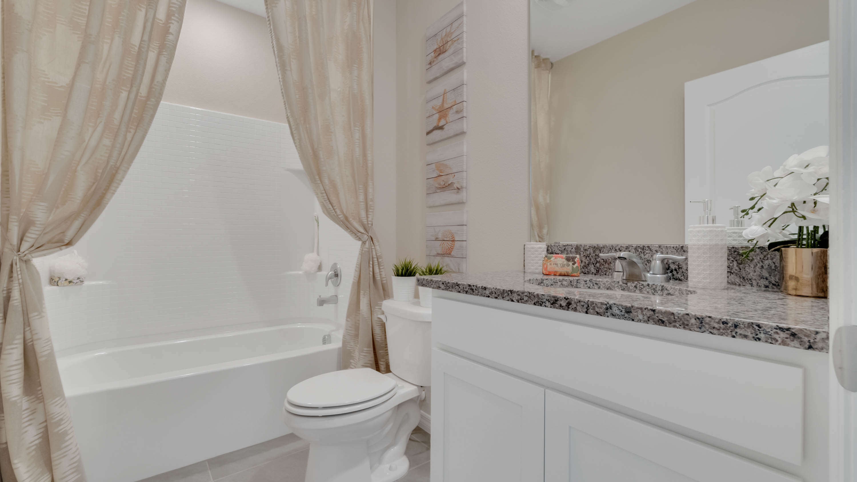 second bathroom with tub and vanity sink