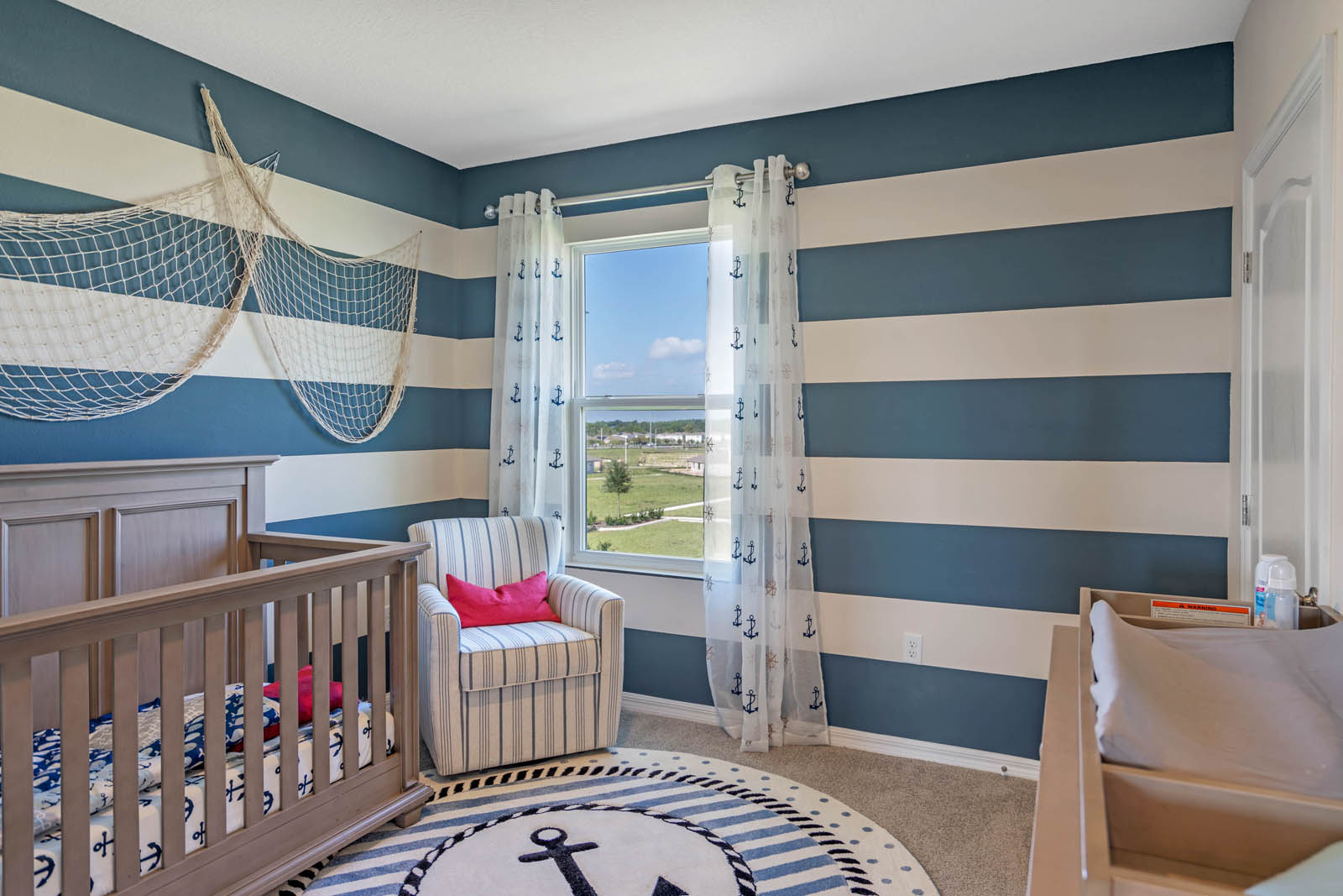 Guest room decorated as nautical nursery