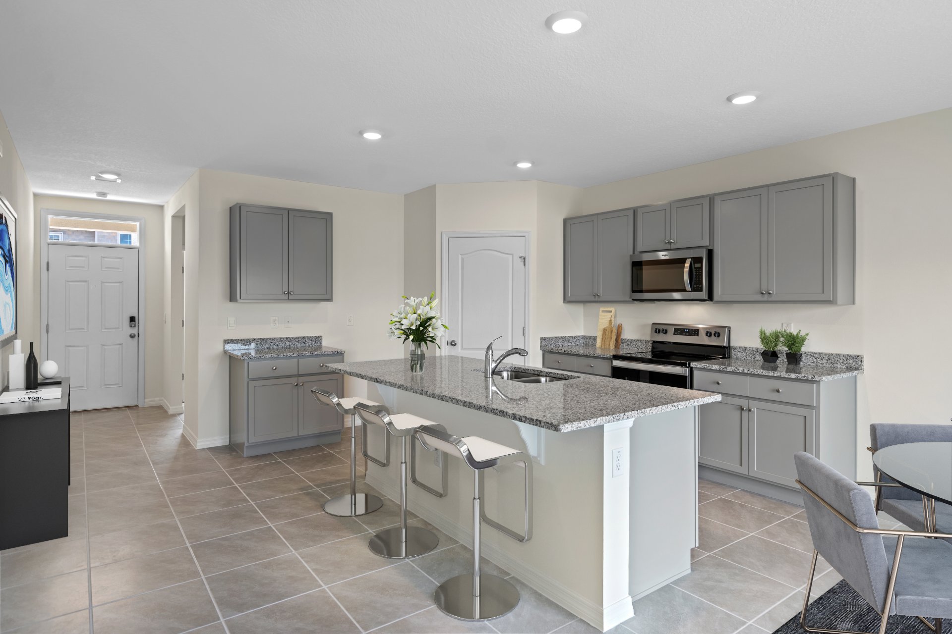 Virtually staged living room and stair access to second floor