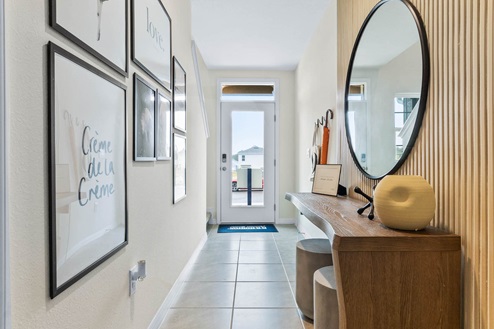 Entry hallway leading to stairs and front door