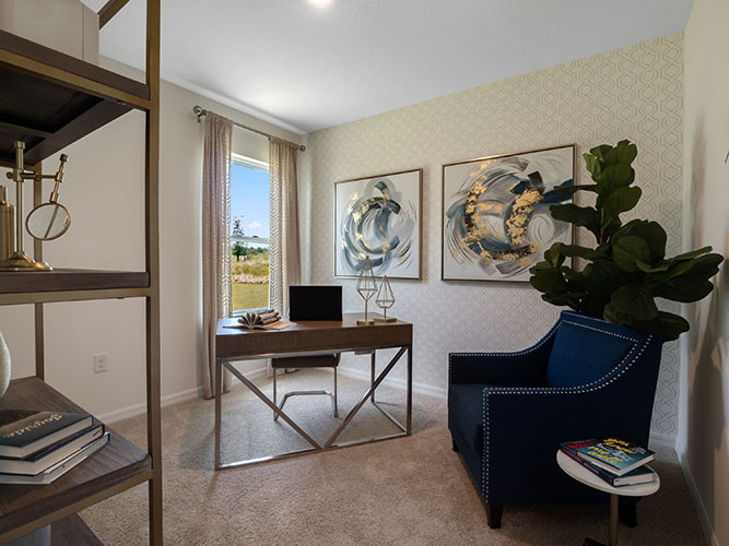 Guest bedroom with office set up and carpet flooring