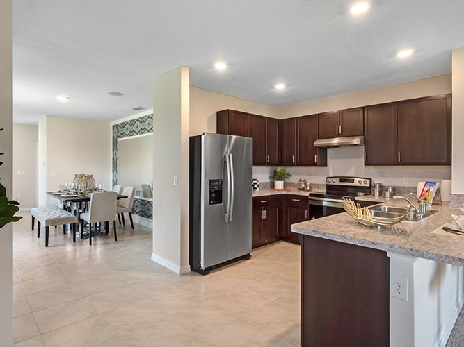 Kitchen with peninsula and stainless steel appliances
