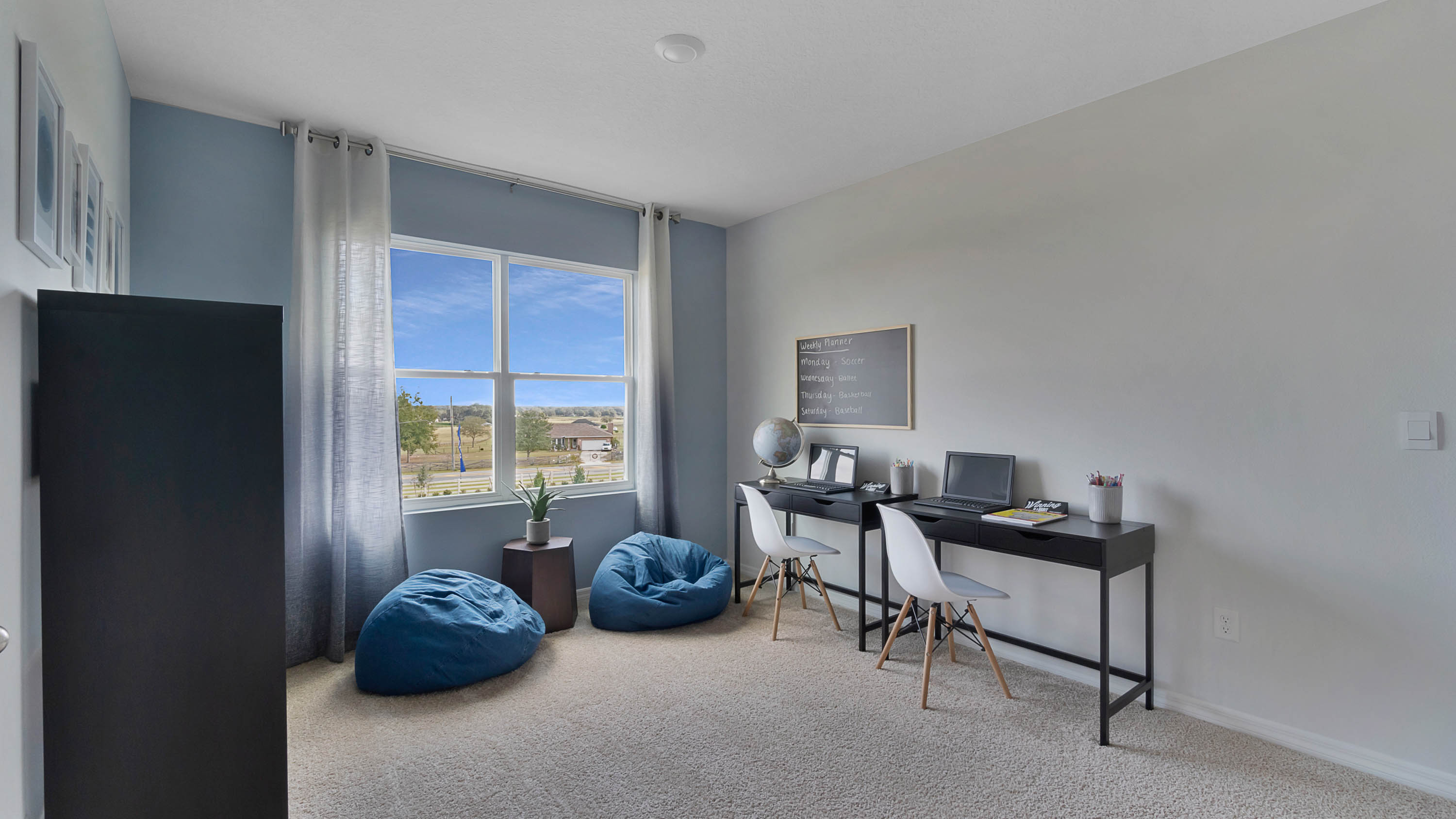 upstairs flexroom with desks and bean bag chairs