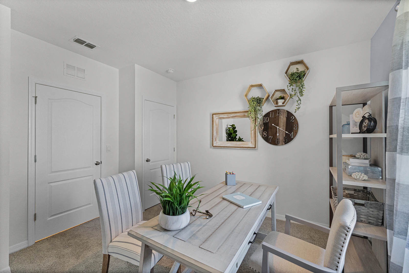 side image of the office space. Closet space inside the guest bedroom.