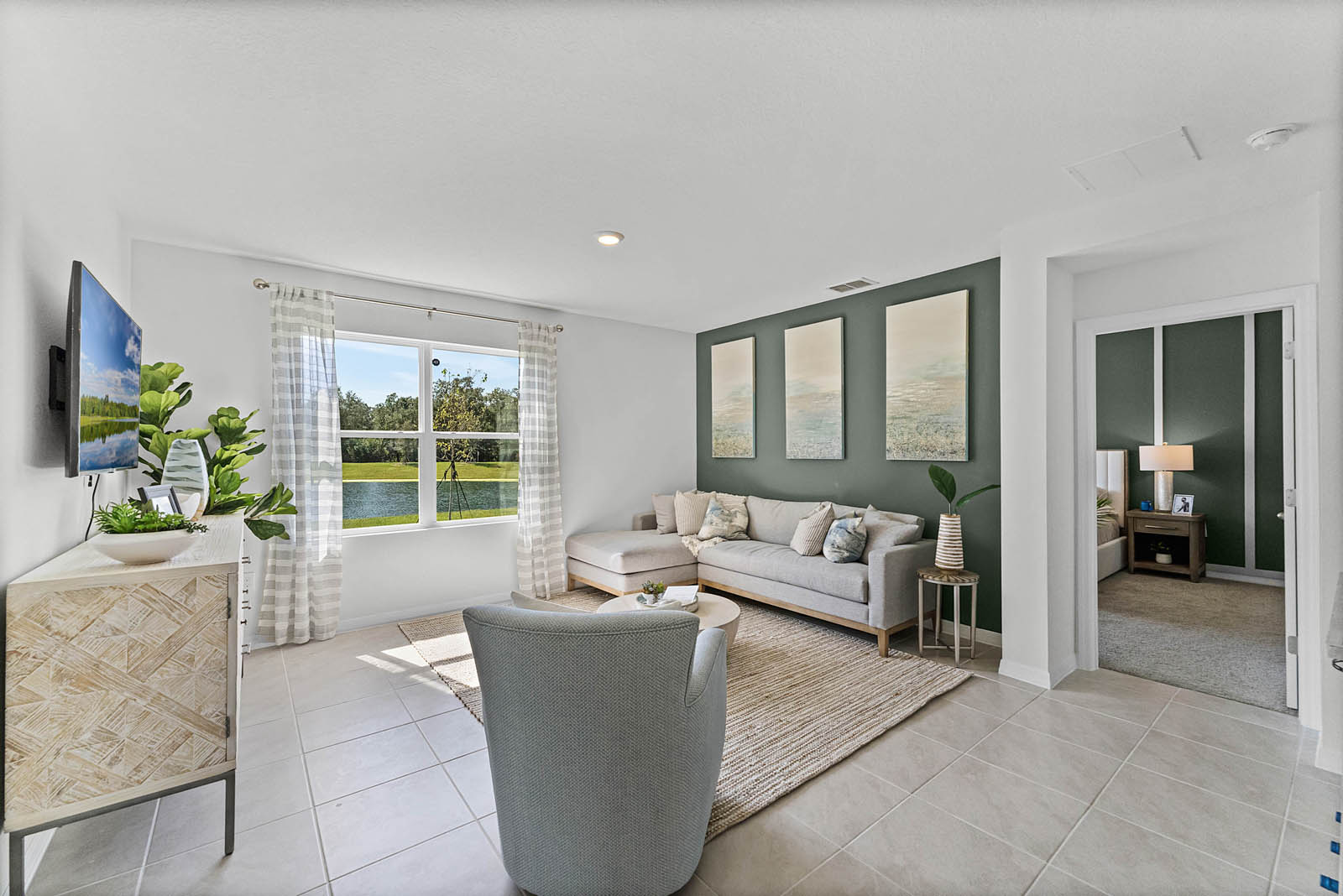 Living room with window facing the backyard.