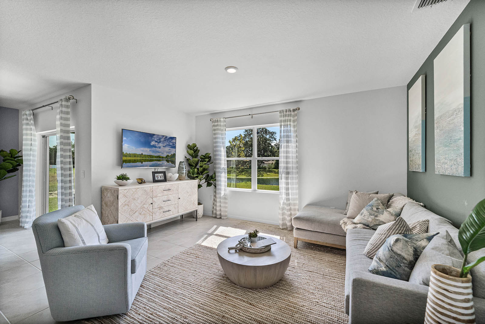 Living room with view of the dining area.