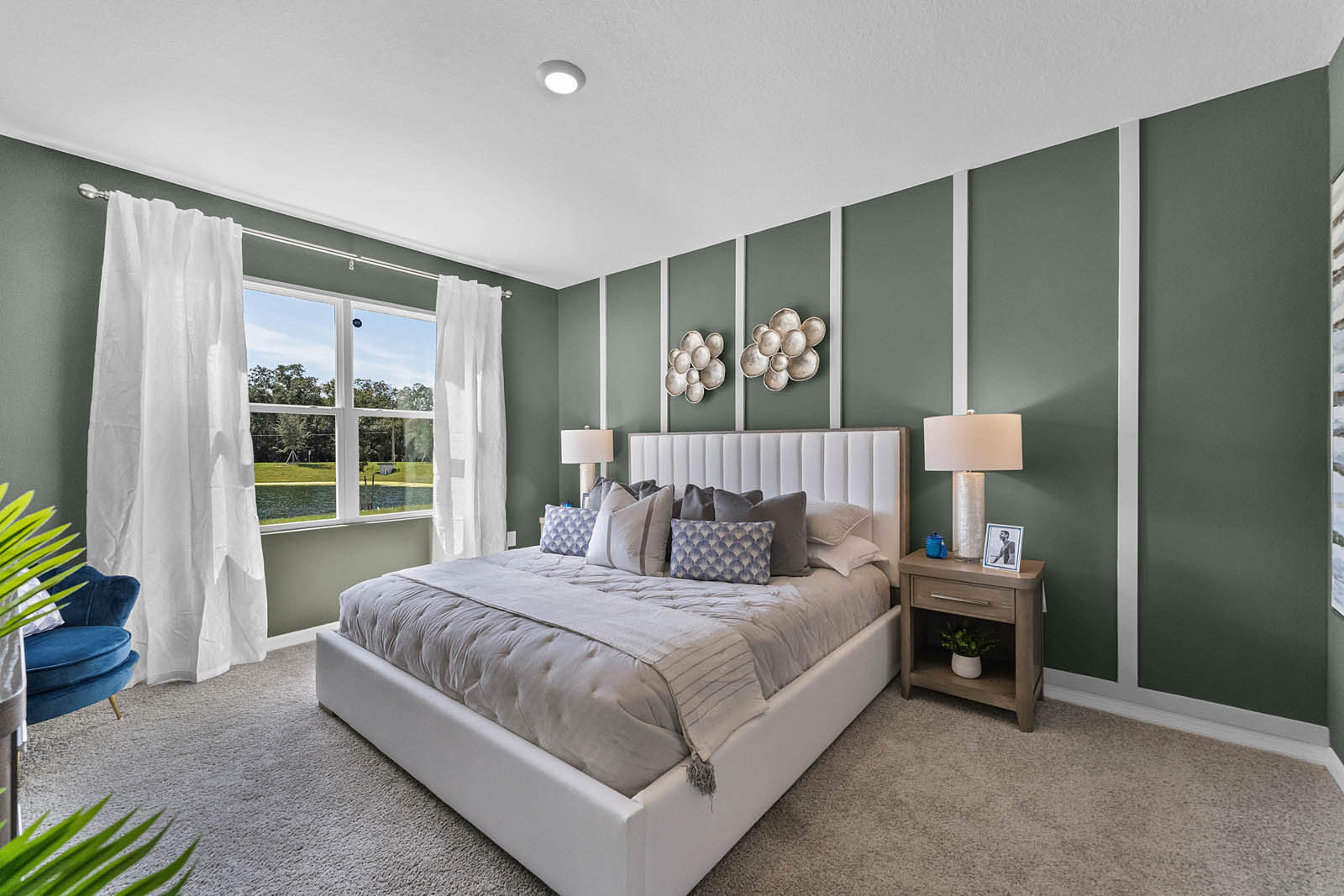 Primary Bedroom with night stands, bed and vanity.