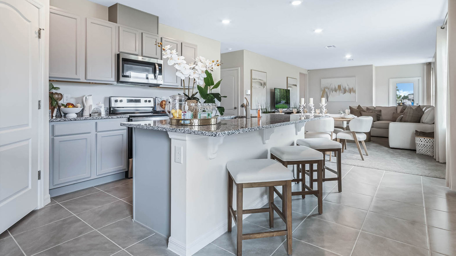 Open concept kitchen with views to the living room and dining room