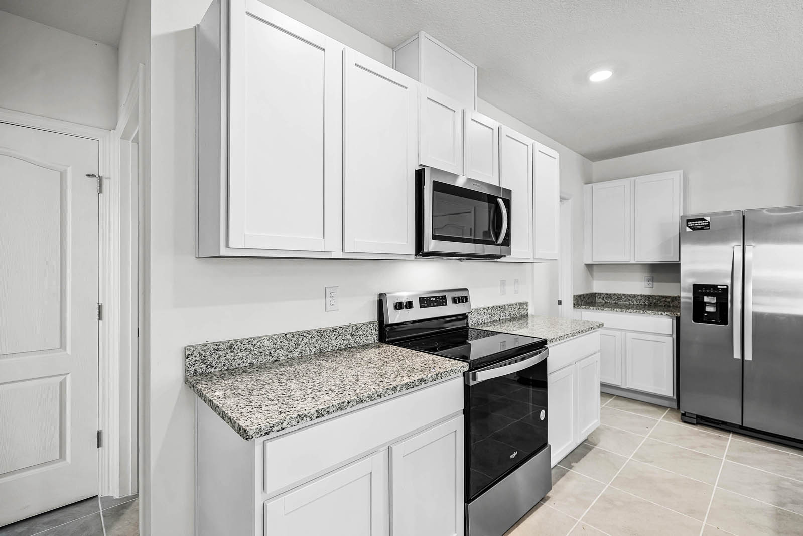 White cabinets in the kitchen and stainless steel appliances