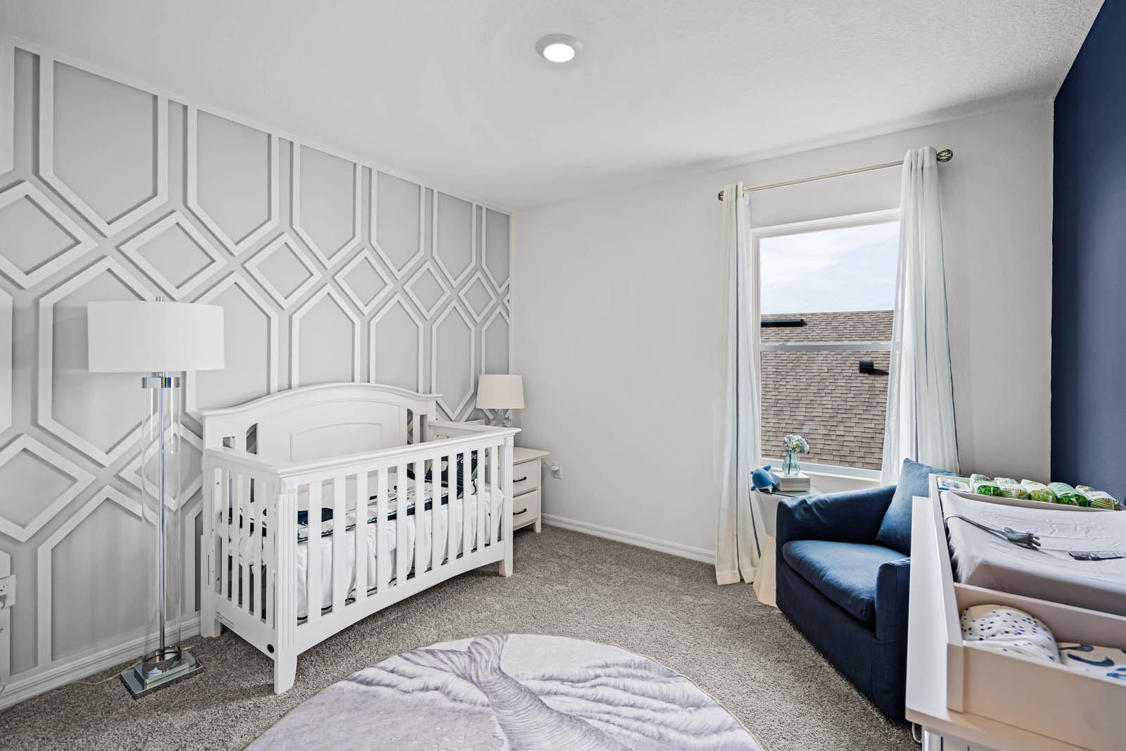 Spare room nursery with crib and changing table