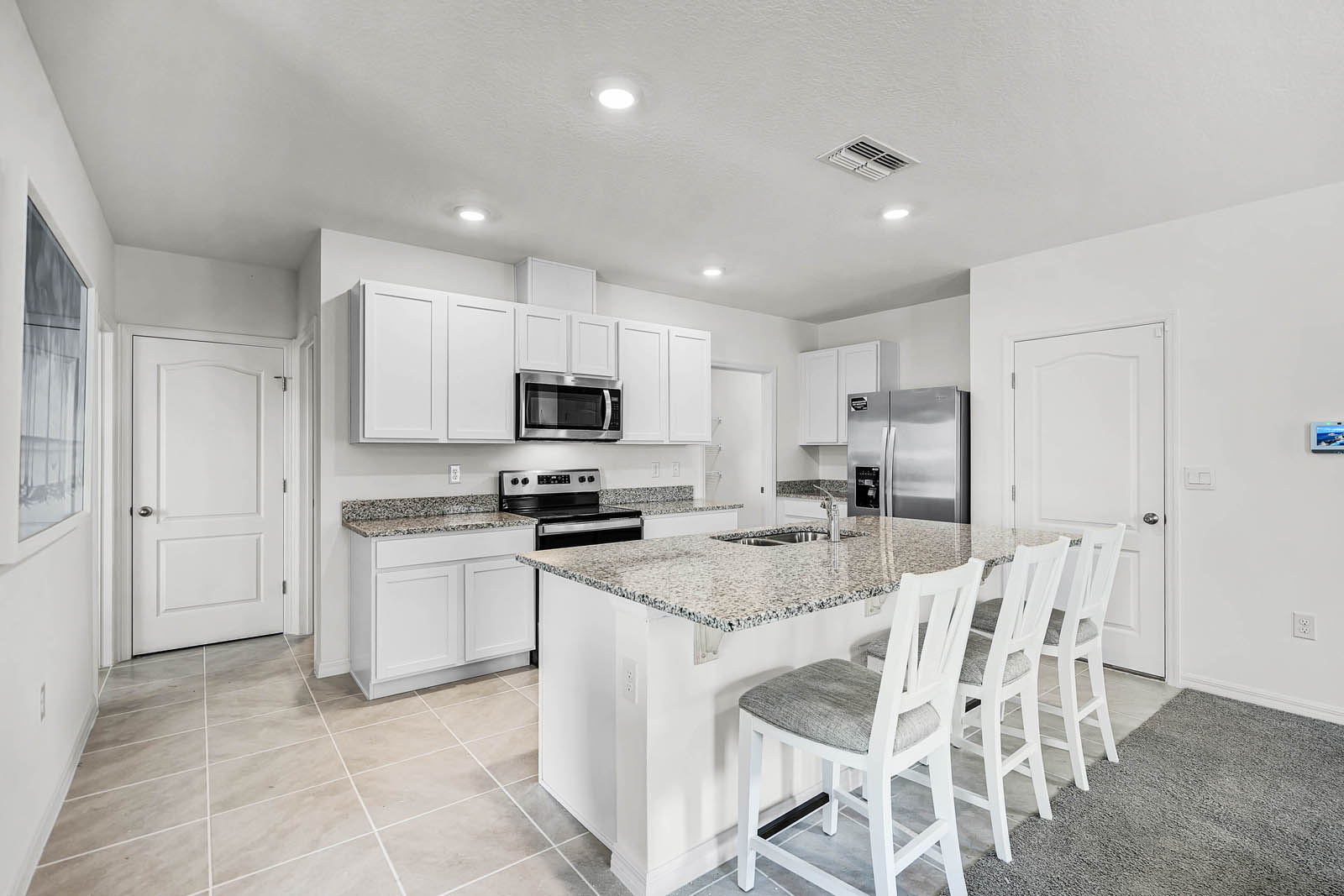 Kitchen island with barstools and stianless sink