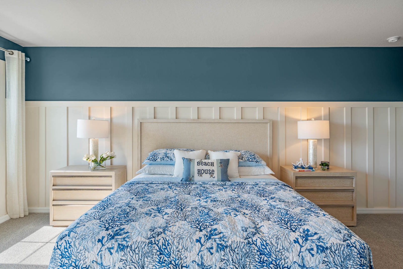 Primary bedroom with king bed with carpet throughout