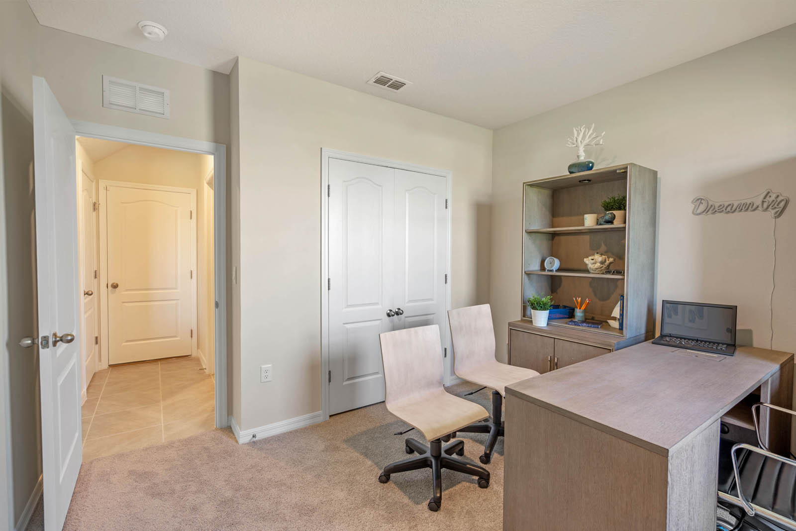 Office with desk and bookshelf