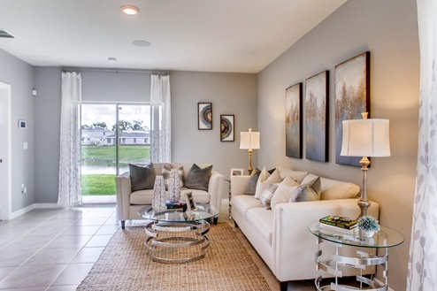 Living room area with a couch and ottoman