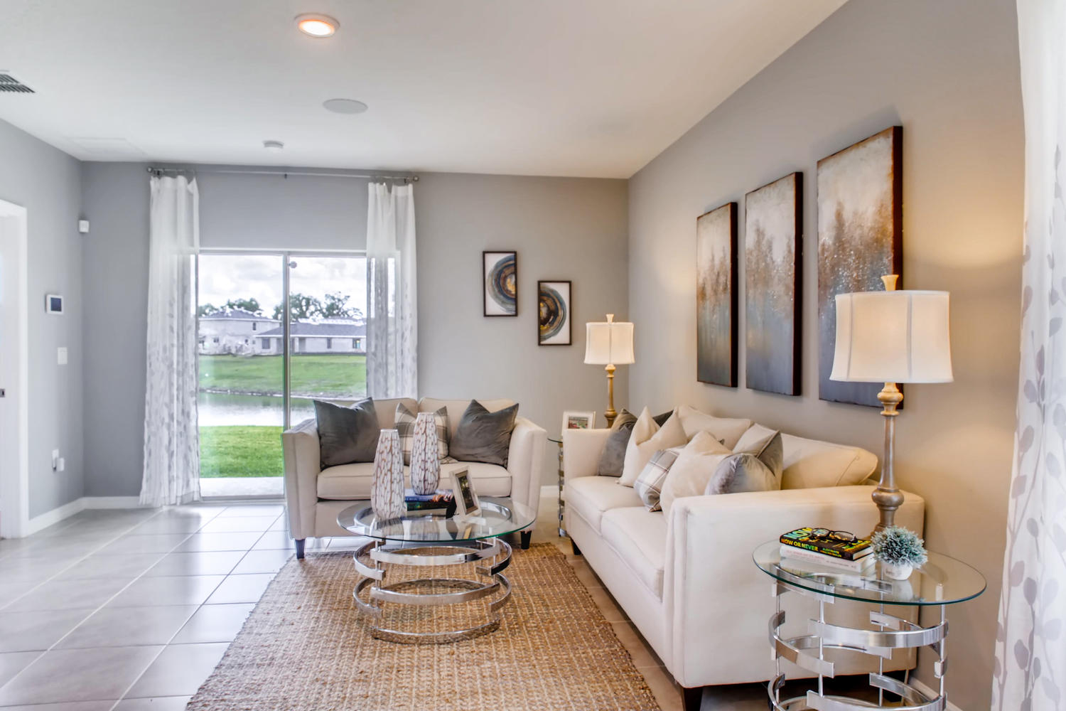 Living room area with a couch and ottoman