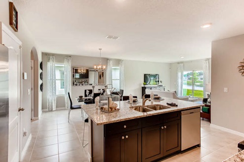 Open concept living room with views to the dining room and kitchen