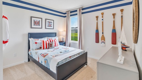 Guest bedroom with full bed and nautical decor