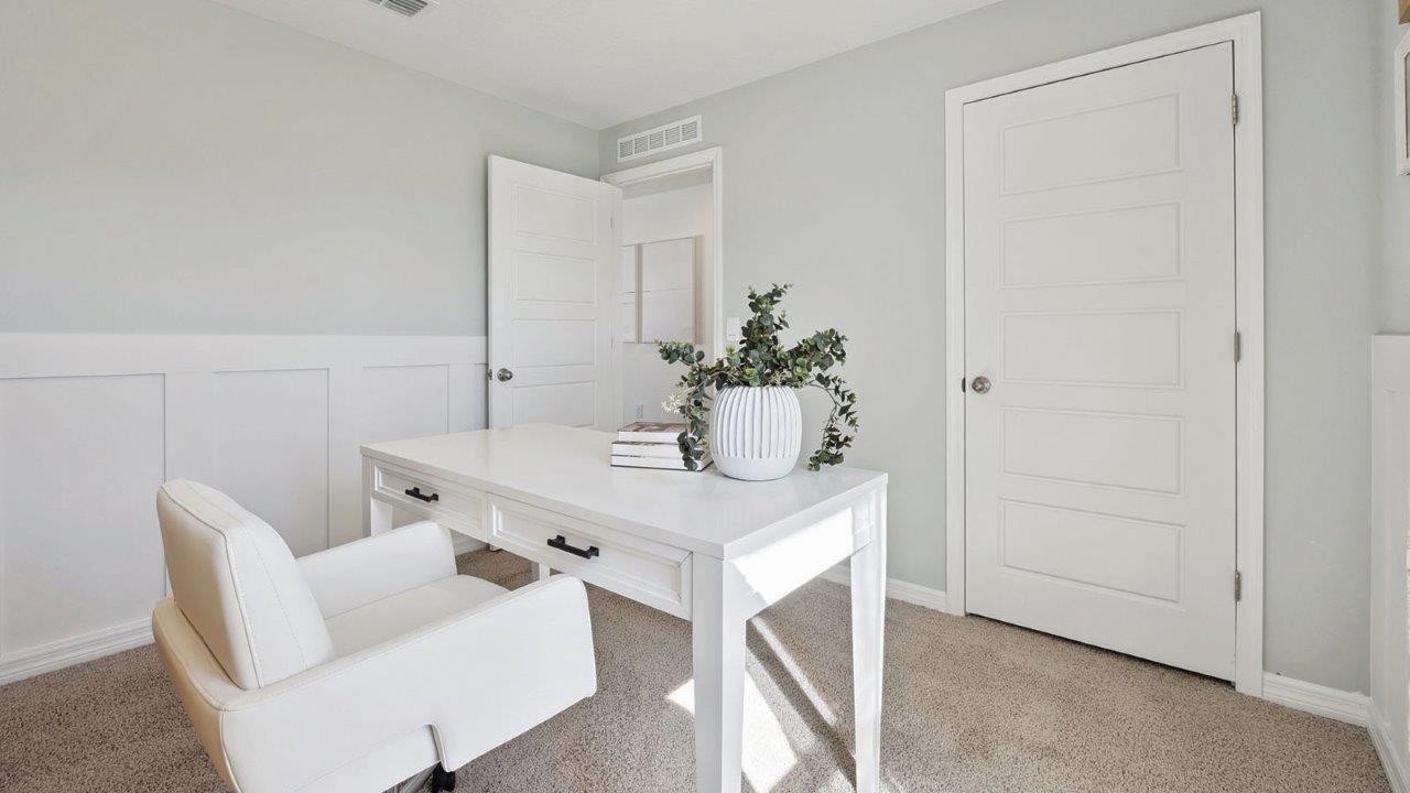 guest bedroom with carpet