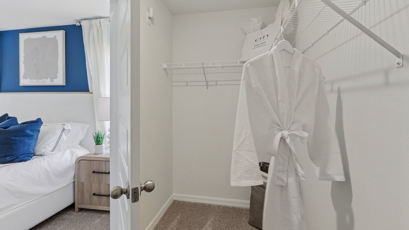 Walk in closet in the primary bedroom