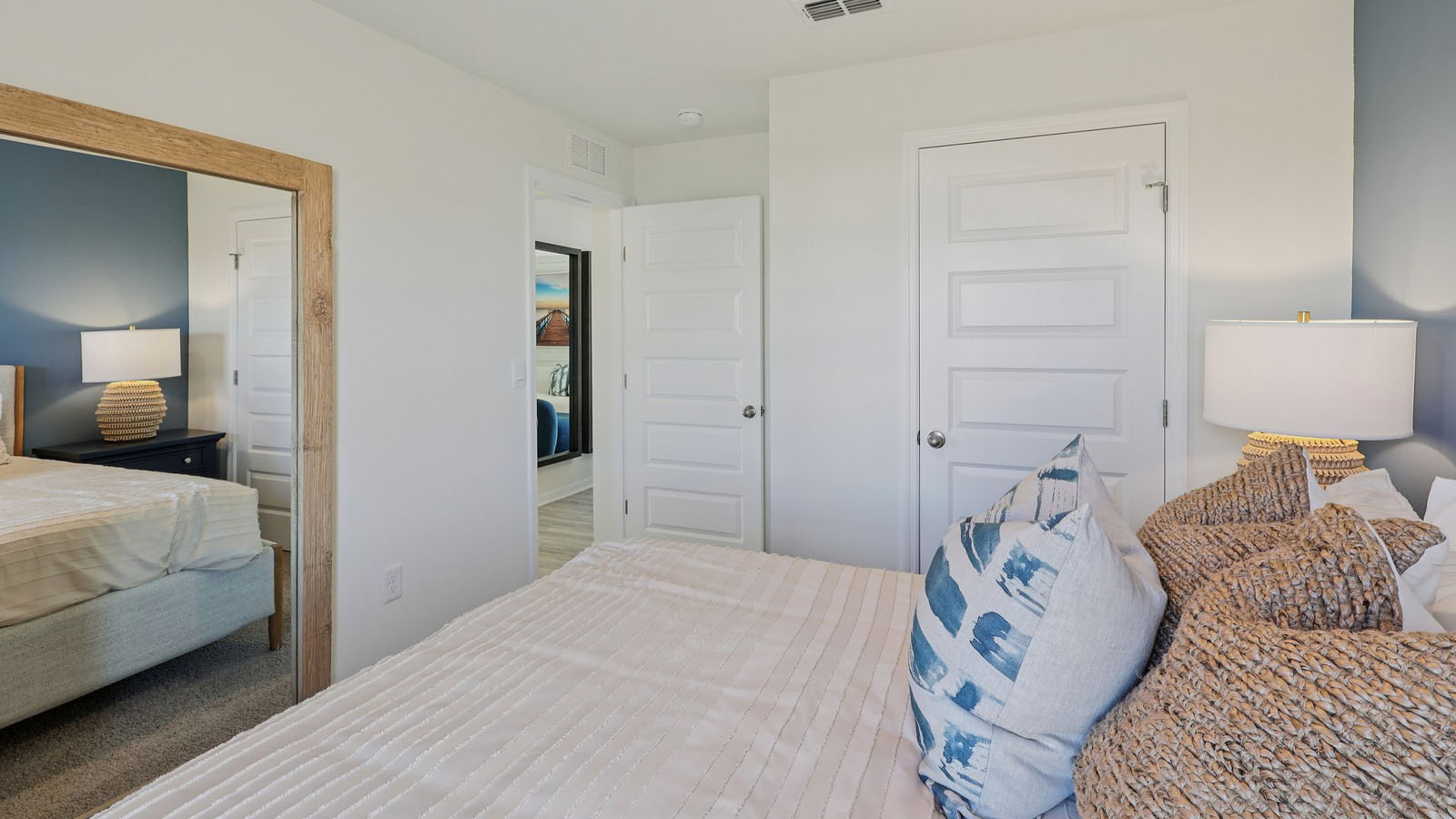 Guest bedroom with closet and queen size bed