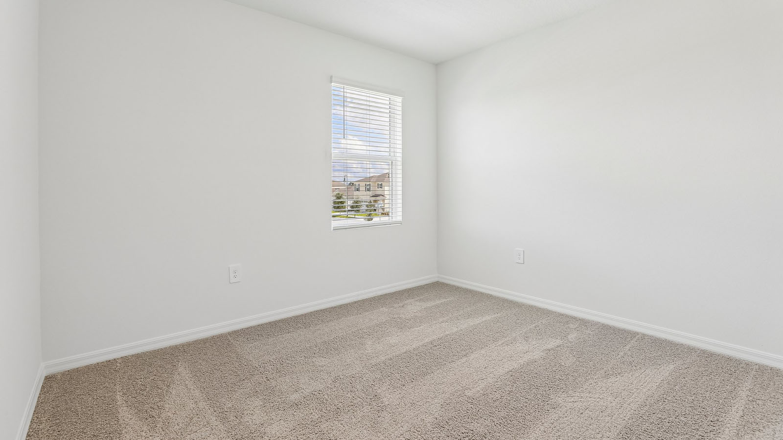 Guest Bedroom with window and carpet