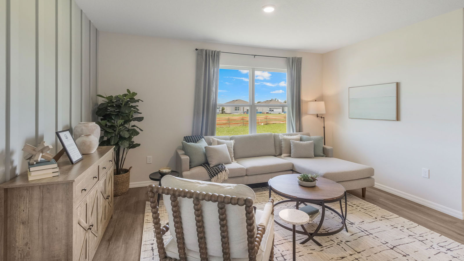Living room with a window to the backyard