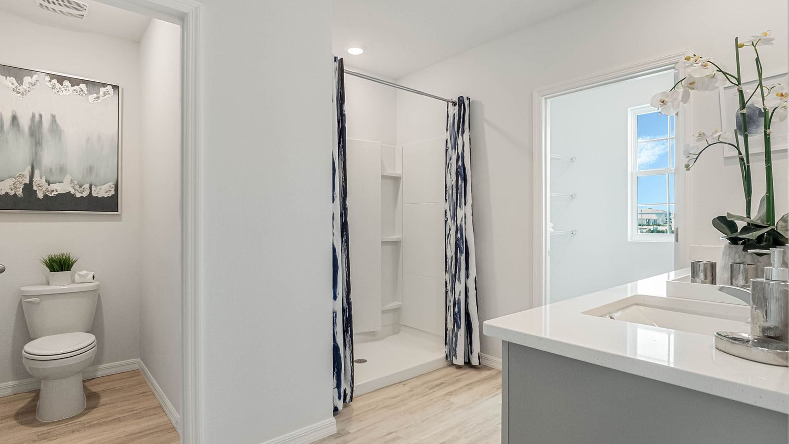Primary bathroom with walk in shower and two closets
