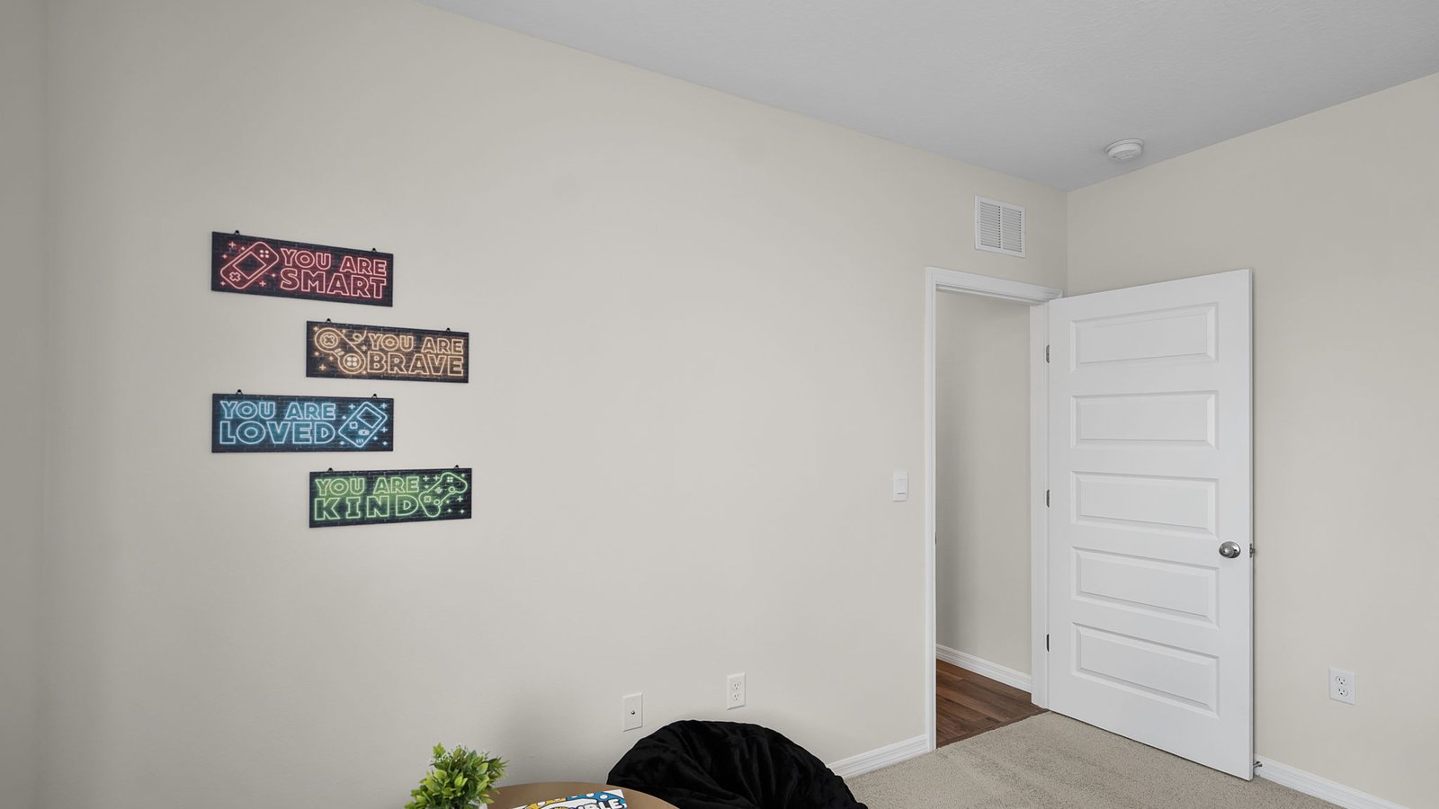 Cozy nursery with window and carpet flooring