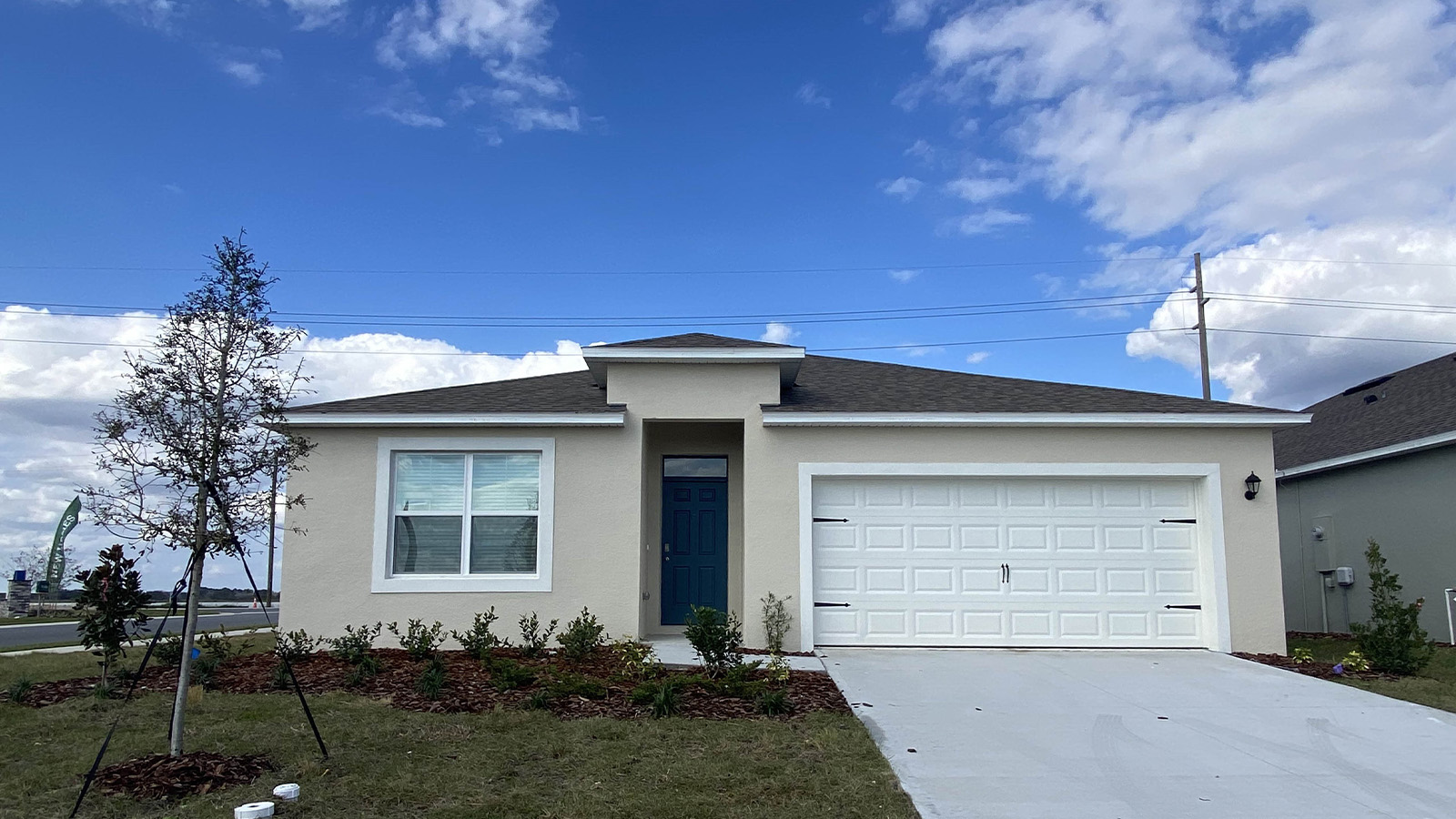 Exterior single family home with two car garage