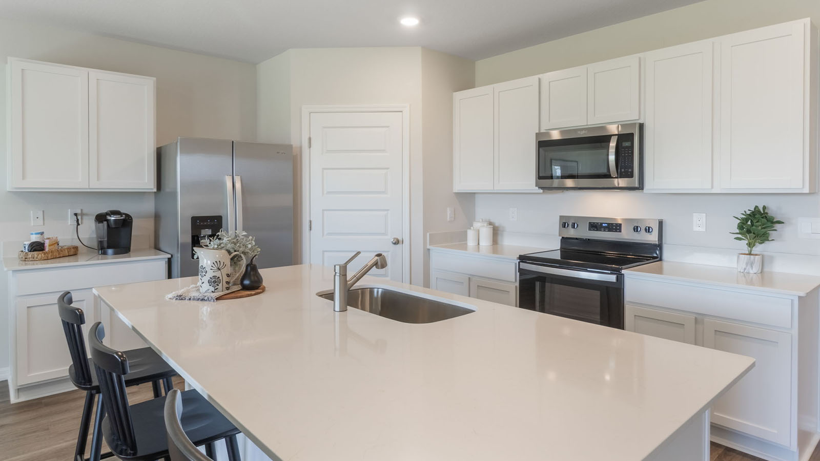 Kitchen island with stainless steel appliances