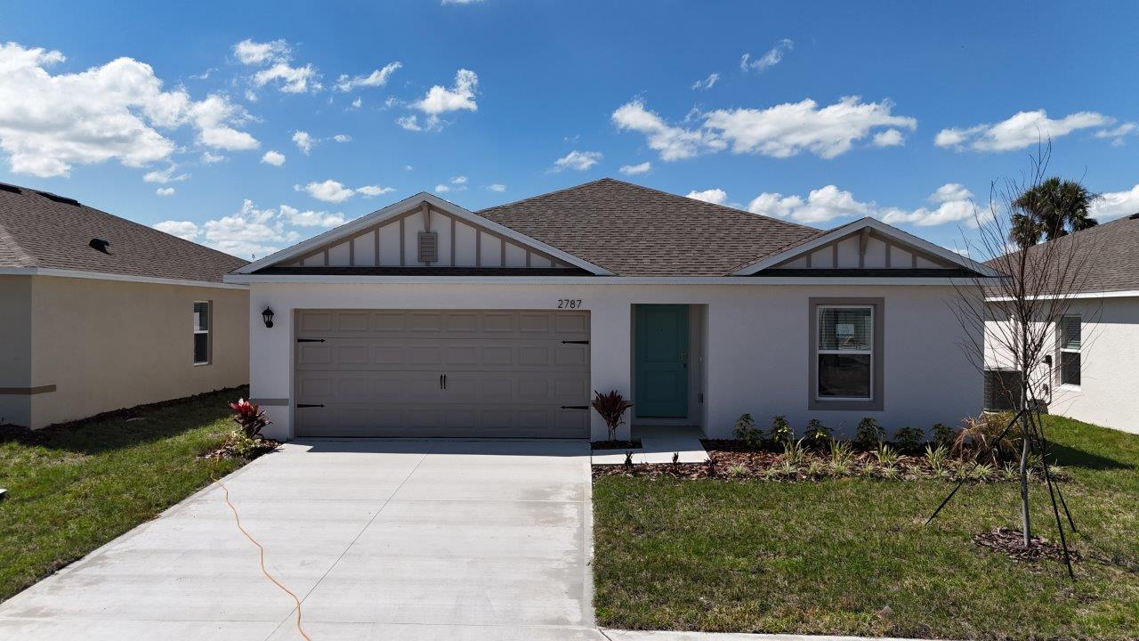 Exterior single family home with two car garage