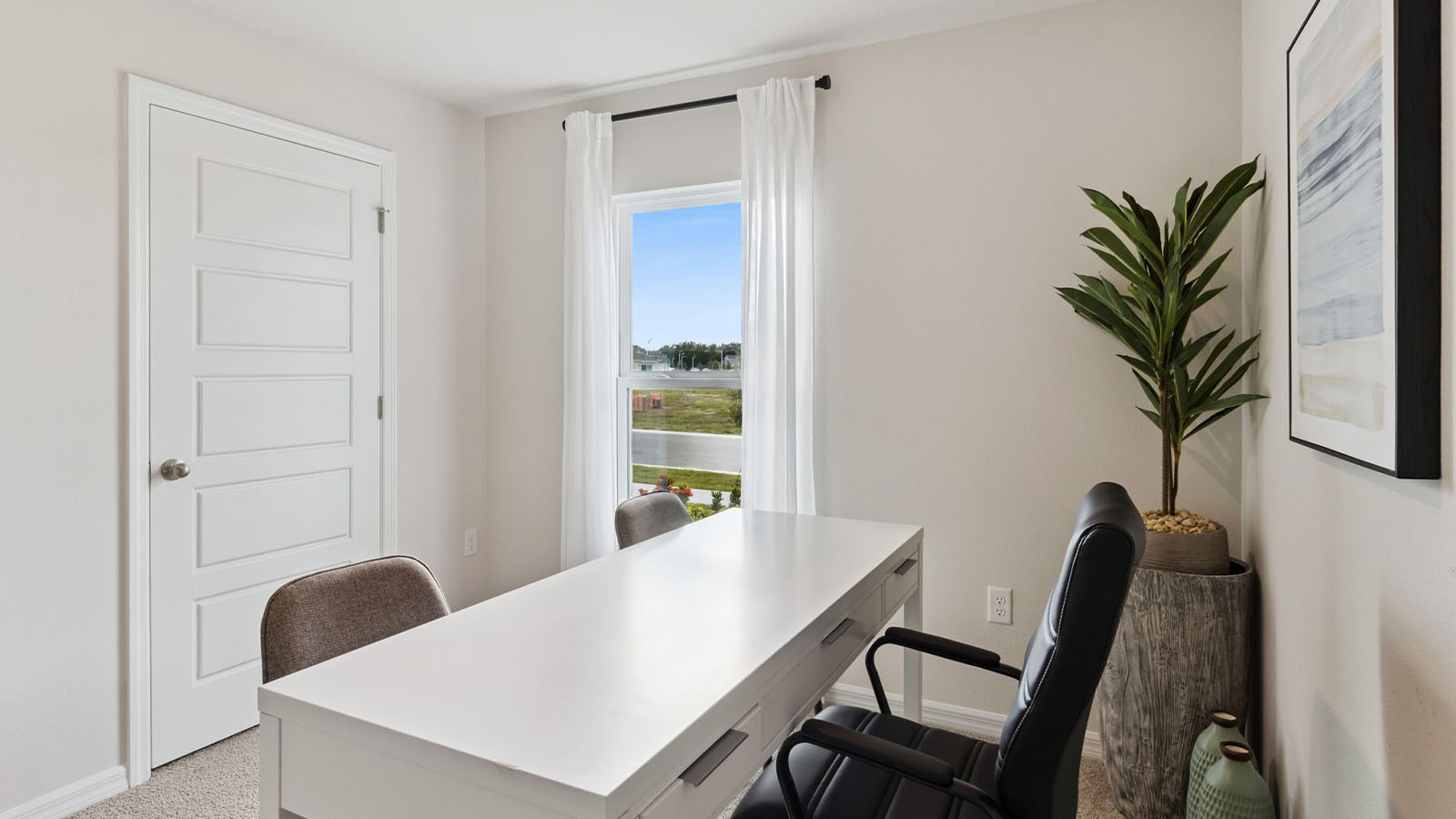 Guest bedroom as an office with carpet