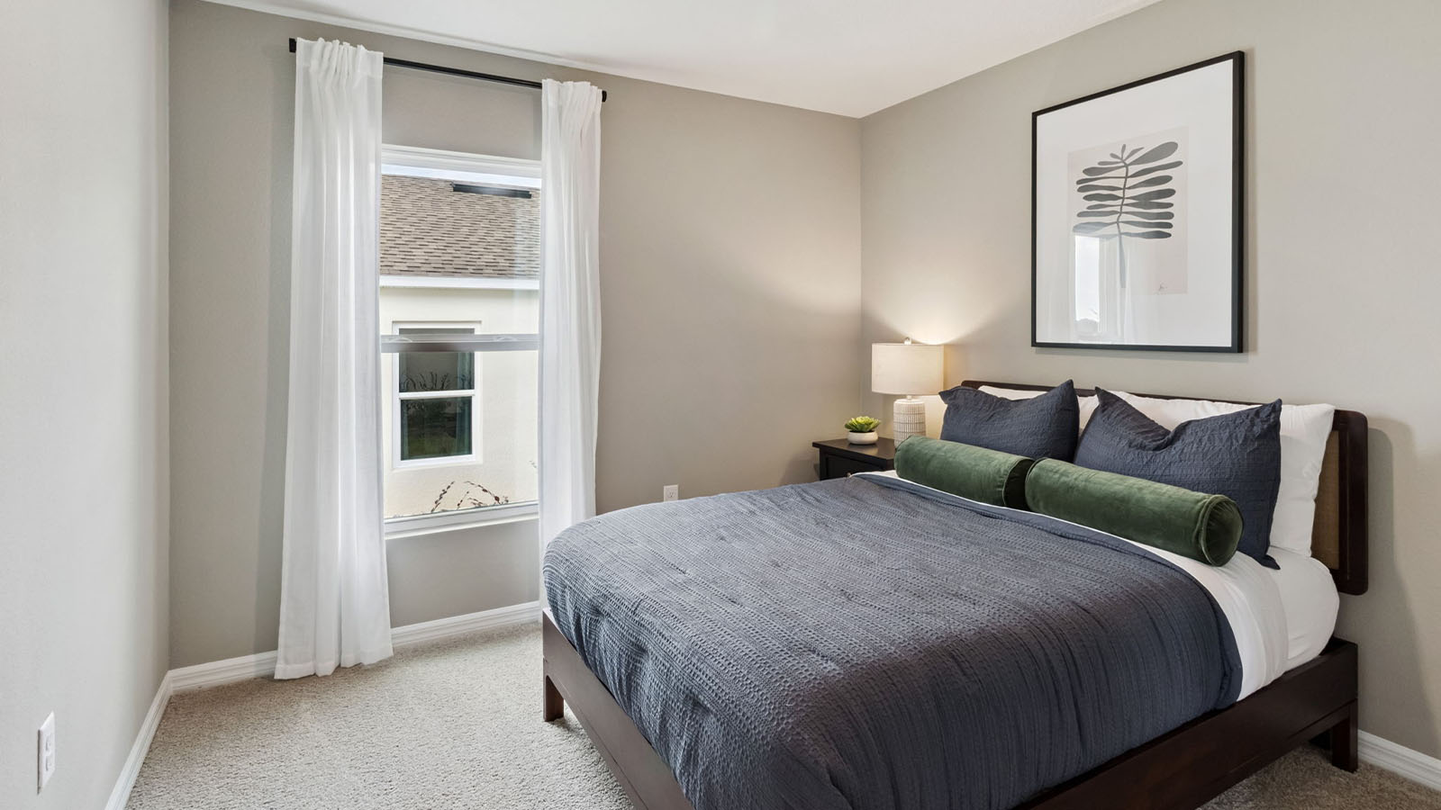Guest bedroom with carpet flooring