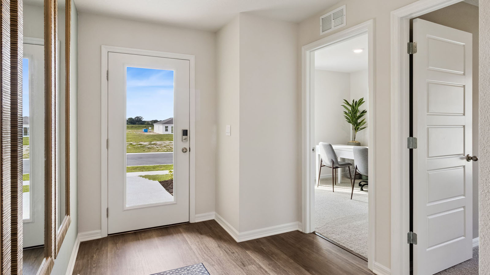 Entry way with entrance to the two rooms