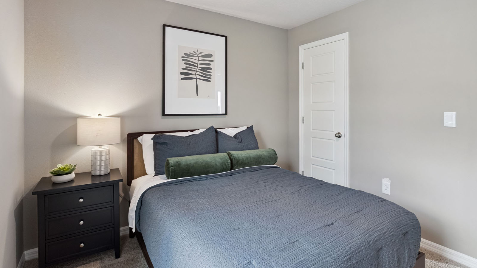 Guest bedroom with carpet flooring