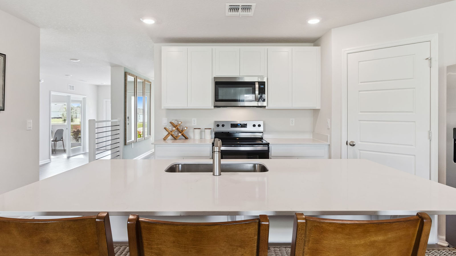 Kitchen island with stainless steel appliance