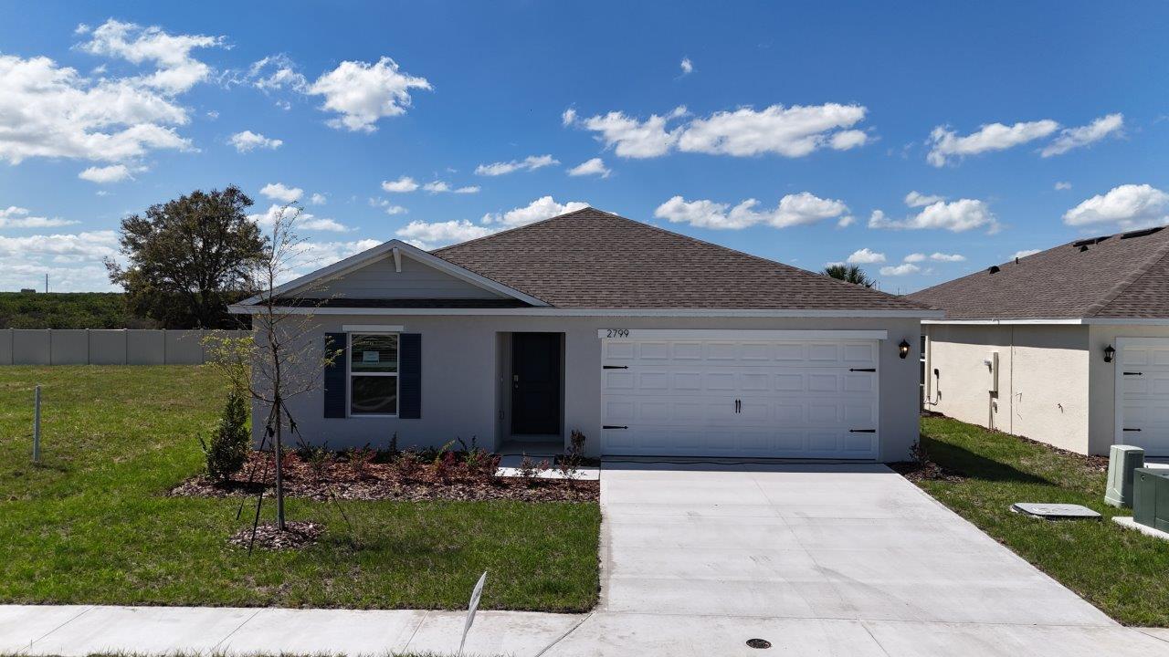 Exterior single family home with two car garage