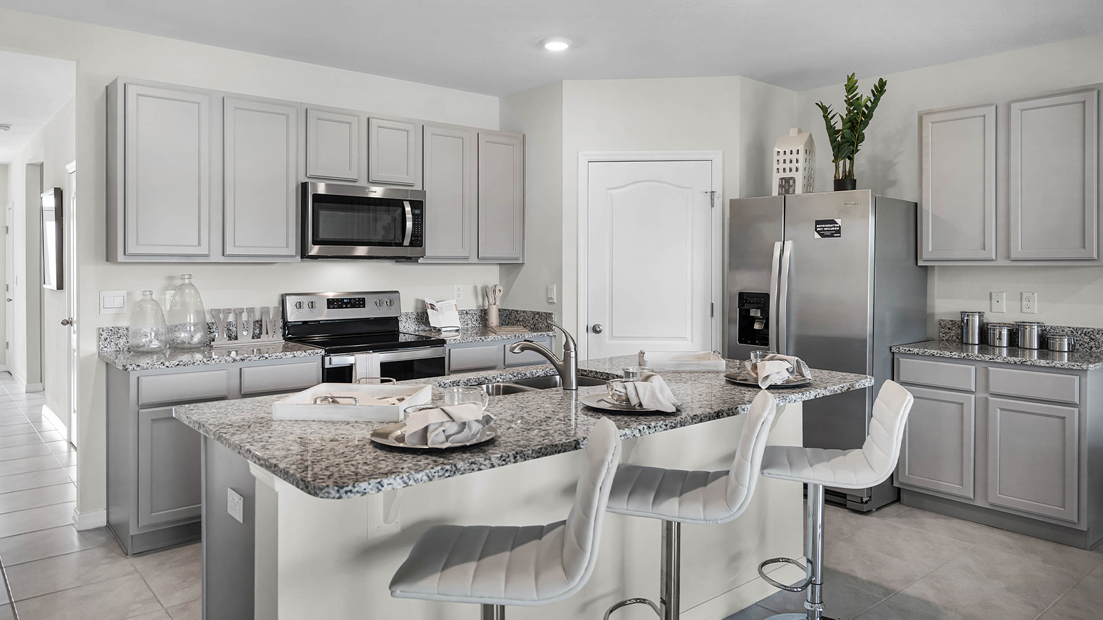 Kitchen island with pantry, stove and fridge
