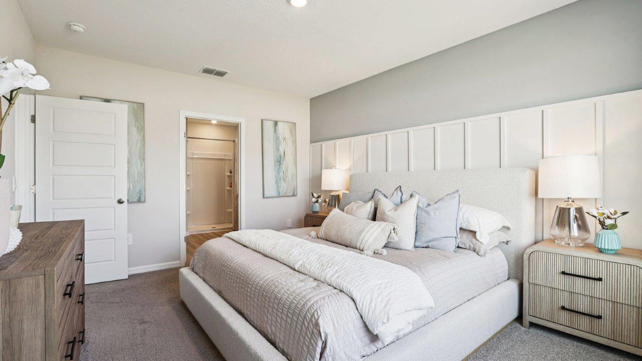primary bedroom with king size bed and night stands
