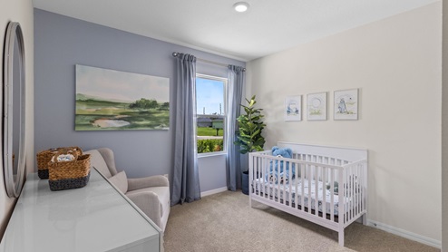 Guest bedroom furnished as a nursery